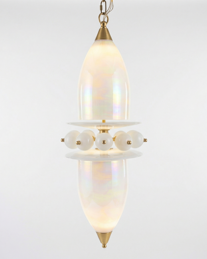 Decorative pendant light with a glass shade and gold accents on a white background