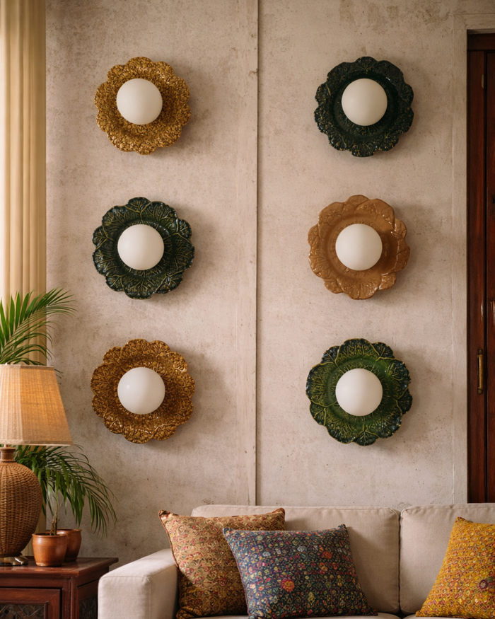 Decorative wall light with spherical lights on a beige wall, with a sofa and lamp in the foreground.